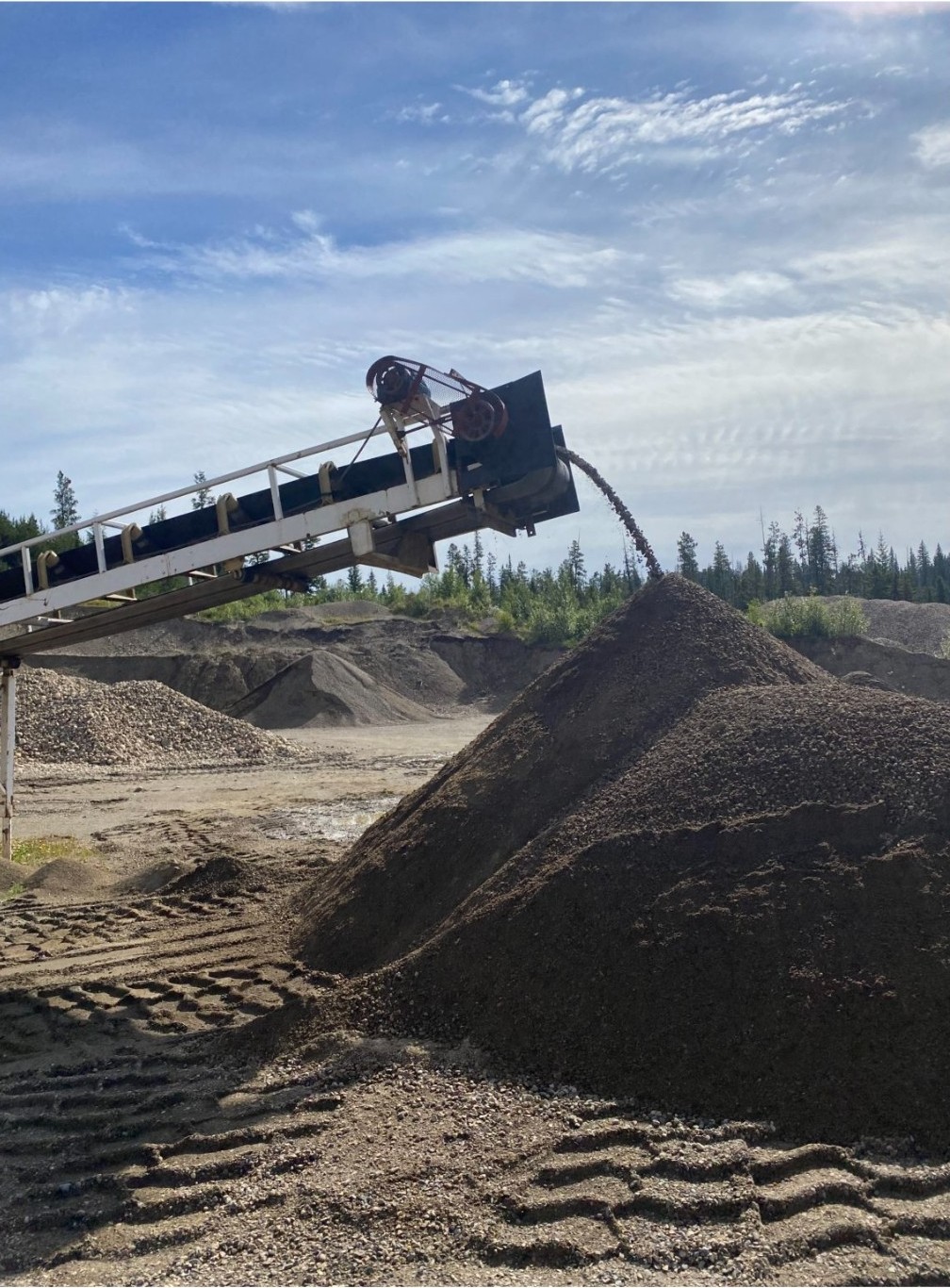 Aggregate conveyor dumping material Prince George